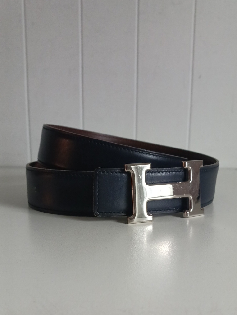 HERMES NAVY TAN REVERSIBLE SILVER H CONSTANCE BELT.